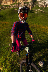 Vertical photo of young athlete view from above wide angle. Professional rider on mountain bike