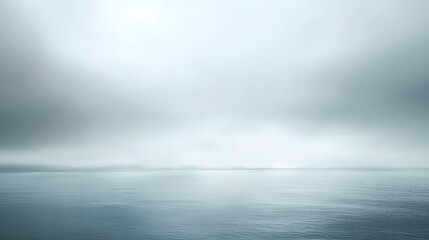 Tranquil Seascape with Soft Haze and Calm Water Reflections