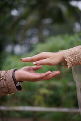 Close-up of Two Hands Reaching Towards Each Other, Symbolizing Connection and Love