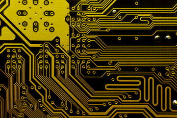 Yellow background of computer motherboard printed circuit board. Macro shot of electronic components
