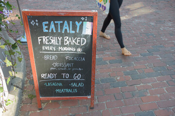 cobblestone road sign outside Eataly at 21 Trinity St, Distillery District, Toronto