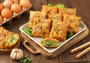 Martabak Telur. Mini egg martabak is a snack made from eggs. Its delicious taste and mini shape make it suitable for serving as a family snack.