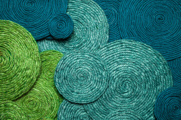 Rolls of fibrous thread forming a unique abstract pattern