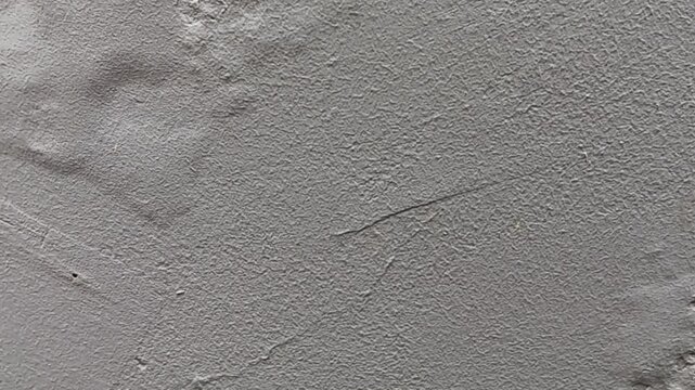 Abstract texture of blistering or bubbles paint on a white wall.	