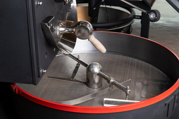 Coffee Roaster Cooling Tray. a professional coffee roasting machine. the crucial cooling stage in coffee bean processing, essential for quality and flavor.