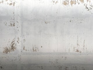 Aged White Wall Texture with Cracks and Peeling Paint. an old, weathered white wall exhibiting...