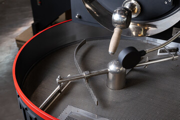 Coffee Roaster Cooling Tray. a professional coffee roasting machine. the crucial cooling stage in coffee bean processing, essential for quality and flavor.