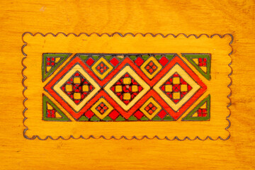 Rare wooden jewelry box, macro, top view.