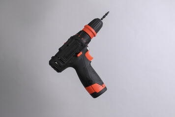 Cordless screwdriver isolated on gray background