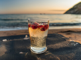 Italian soda drinks served in clear glasses with ocean views and fruit toppings in a photo grid