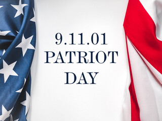 Patriot Day. We will never forget. American flag and lettering. Closeup, isolated background....