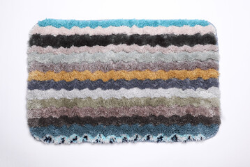 Multicolored shaggy rug on white background