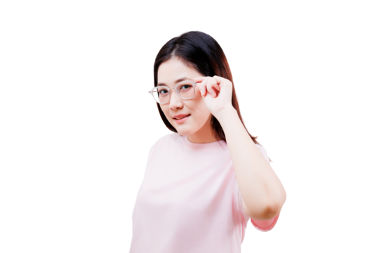 Asian young beautiful woman with long dark hair wearing a light pink shirt adjusts her clear eyeglasses while looking directly at the camera.