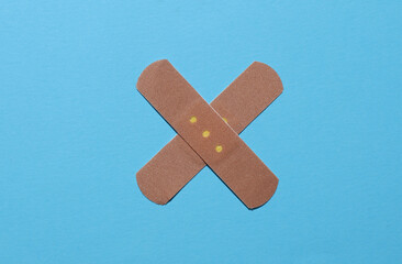 Medical Adhesive bandage plasters on blue background