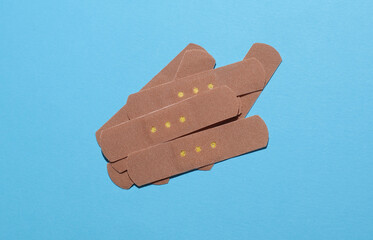 Medical Adhesive bandage plasters on blue background