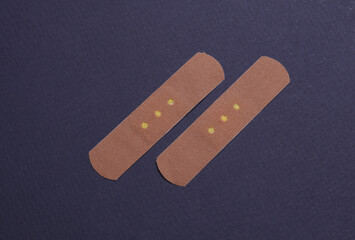 Medical Adhesive bandage plasters on dark background