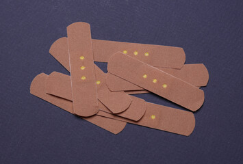 Medical Adhesive bandage plasters on dark background