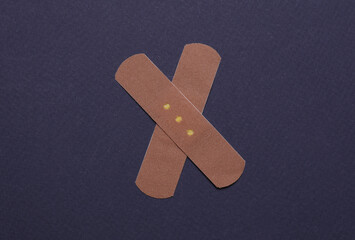 Medical Adhesive bandage plasters on dark background