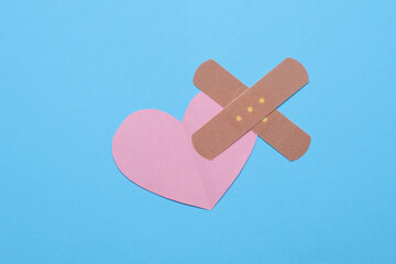 Heart with Medical Adhesive bandage plasters. Broken love concept