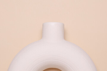 Scandinavian plaster round vase on beige background