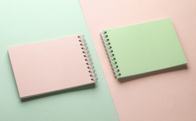 Two notebooks on blue pink pastel background. Minimalism. Creative layout