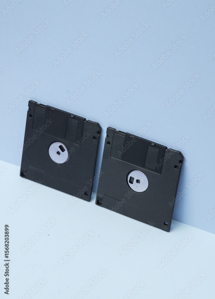Poster outdated technologies. retro 80s floppy disks on blue background. creative layout