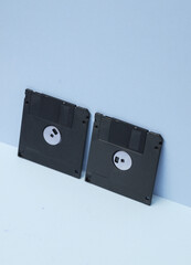 Outdated technologies. Retro 80s floppy disks on blue background. Creative layout