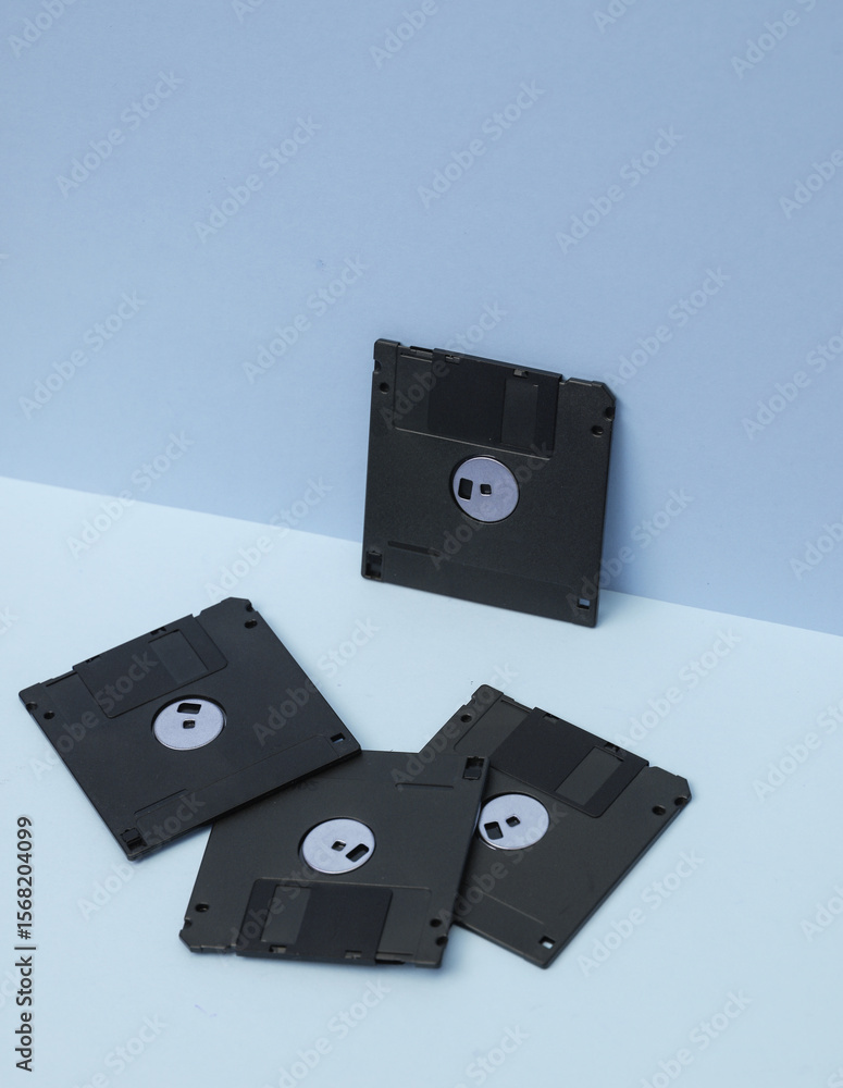 Poster outdated technologies. retro 80s floppy disks on blue background. creative layout
