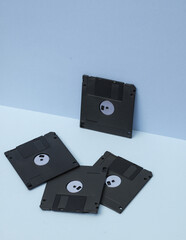 Outdated technologies. Retro 80s floppy disks on blue background. Creative layout