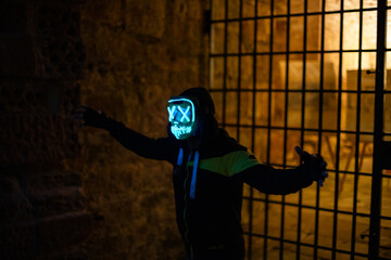 Purge mask, halloween with pumpkin. LED mask, creepy scary man. Corona, Funny, October, outside