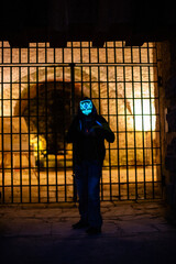 Purge mask, halloween with pumpkin. LED mask, creepy scary man. Corona, Funny, October, outside
