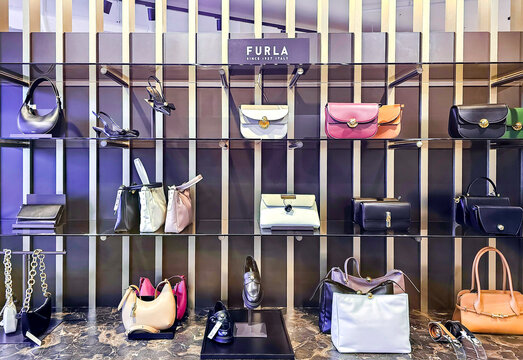 LATVIA, RIGA, 12, JUNE, 2025: Modern interior of Furla boutique with a large collection of bags and shoes in Stockmann shopping mall, Riga. Latvia