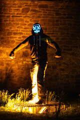 Purge mask, halloween with pumpkin. LED mask, creepy scary man. Corona, Funny, October, outside