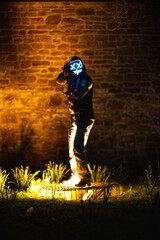Purge mask, halloween with pumpkin. LED mask, creepy scary man. Corona, Funny, October, outside