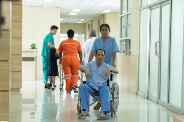 Hospital, healthcare, medical, doctor, nurse staff transports patient on gurney down hospital...