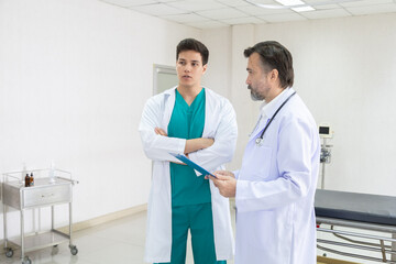 Hospital, healthcare, medical, doctor, nurse team discuss patient diagnosis using clipboard,...