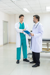 Hospital, healthcare, medical, doctor, nurse team discuss patient diagnosis using clipboard,...