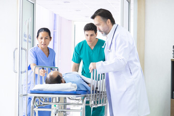 Hospital, healthcare, medical, doctor, nurse rush patient through corridor on emergency gurney, providing fast response and teamwork under pressure in critical situation, surgeon senior physician team