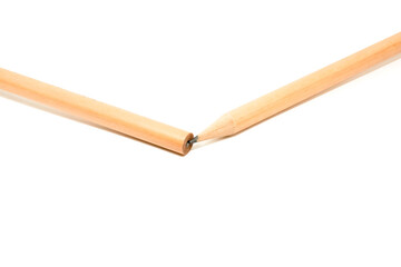 A broken pencil with its sharpened tip placed against the back end of the other half, symbolizing a persistent yet misaligned effort to keep going despite being broken.