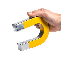 Hand holding yellow horseshoe magnet against black background