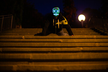 Purge mask, halloween with pumpkin. LED mask, creepy scary man. Corona, Funny, October, outside