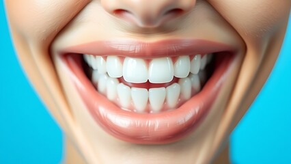 Bright white teeth with a radiant smile against a clean blue gradient background.