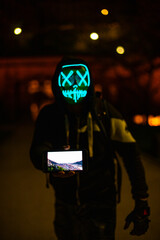 Purge mask, halloween with pumpkin. LED mask, creepy scary man. Corona, Funny, October, outside