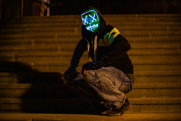 Purge mask, halloween with pumpkin. LED mask, creepy scary man. Corona, Funny, October, outside