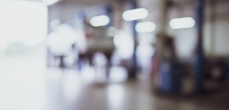 Abstract blurred background showing an interior space with lights and indistinct shapes. - Powered by Adobe