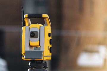 Close-up of Construction site with surveying equipment theodolite total station highlighting the...