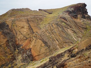 Desert landscapes of Cape Sao Lourenco. Colourful patterns on rocks formed by lava. Nature of...