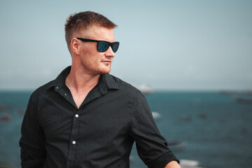 Summer fashion smart casual male model wearing sunglasses