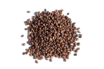 There is a pile of unpeeled pine nuts on a white background.