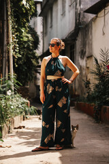 Summer fashion model, beautiful woman wearing green clothes and sunglasses